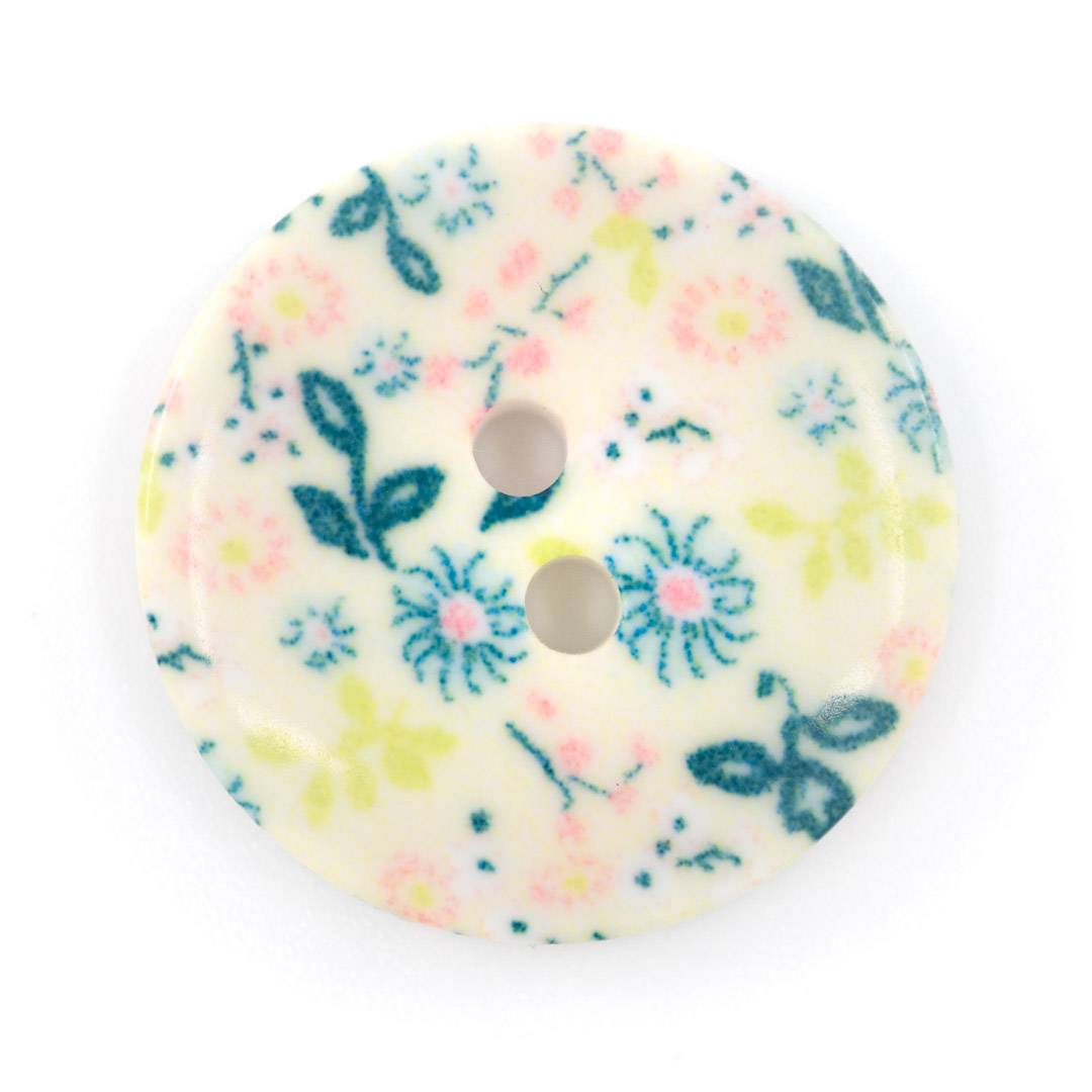 Bouton décor fleuri bleu en plastique